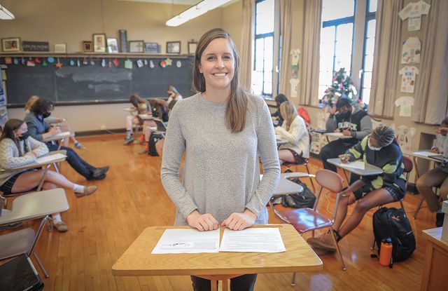 Physical Education and Psychology Teacher Erin Power, a Fenwick alumna from the Class of 2007, also helps run the freshman SHIELD orientation program. Oh, and she's a dog lover!